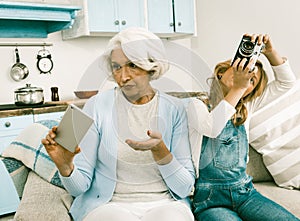 Grandma And Her Grandchild Cannot Understand Each Other`s Gadgets
