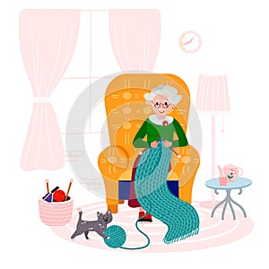Grandma knitting quilt of yarn in cozy armchair. Old woman happy with her hobby in living room. Elderly Lady with cat in