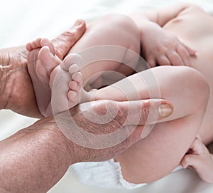 Grandma's hands taking care of the baby