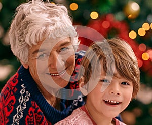 Grandma always visits at christmas. Portrait of a grandmother and her grandson at Christmas.