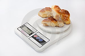 Grandmas bun rolls on the digital kitchen scale