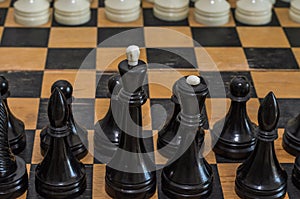 Grandmaster playing chess on a chessboard