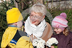 Grandmather and grandsons in park