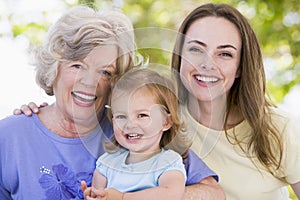 Grandmother with adult daughter and grandchild