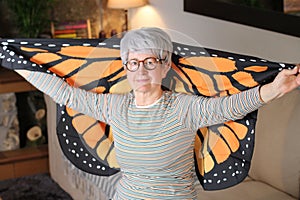 Grandmother with beautiful wings at home