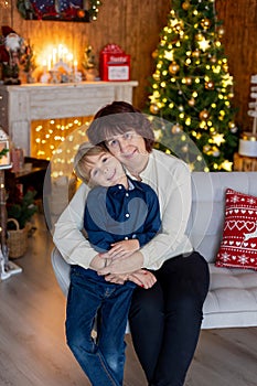 Grandmother and child at home on christmas, reading, writing letter, baking, enjoying the holidays