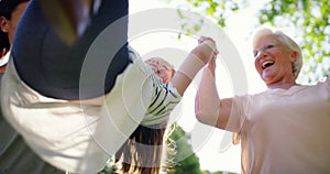 Grandmother, child or mom playing in park for fun games on family holiday to relax together. Holding hands, happy woman