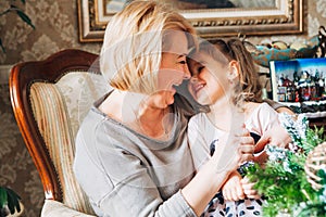 Grandmother with child preparing for Christmas