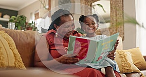 Grandmother, child and reading a book in living room, home and fiction for storytime on weekend. Black family, love and