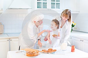 Grandmother cooking with daughter and granddaughter