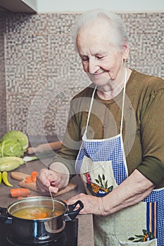 Grandmother cooking on a stove