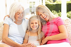 Grandmother, Daughter And Granddaughter Relaxing