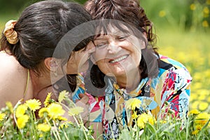 Grandmother with daughter in outdoor.