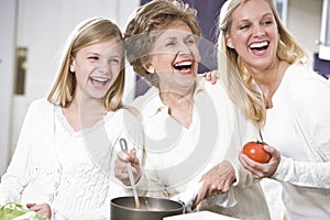 Grandmother with family laughing in kitchen