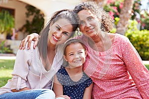 Grandmother In Garden With Daughter And Granddaughter