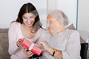 Grandmother Giving Gift To Her Granddaughter