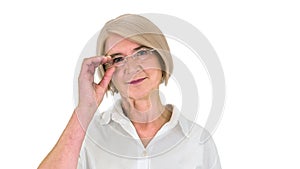 Grandmother in glasses and with gray hair happy and smiling looking to camera on white background.