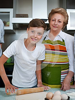 Grandmother with grandchild baking cookies prepare dough