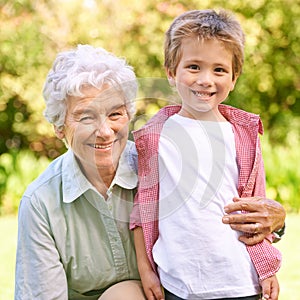 Grandmother, grandchild and hug with park, love and smile with portrait for senior and happiness. Woman, child and