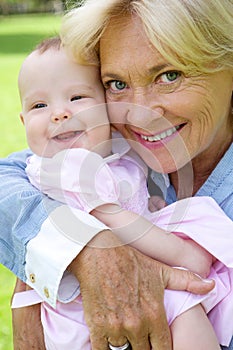 Grandmother and grandchild smiling