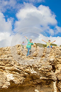 Grandmother and grandchildren rock climbing