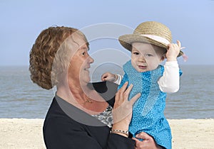 Grandmother with granddaughter,at the beach