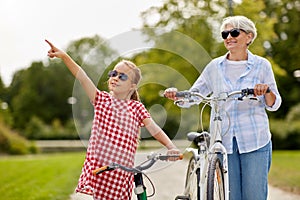 Grandmother and granddaughter with bicycles