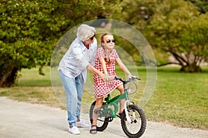 Grandmother and granddaughter with bicycles