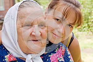 Grandmother and granddaughter embraced and happy photo