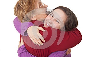 Grandmother and granddaughter hugging