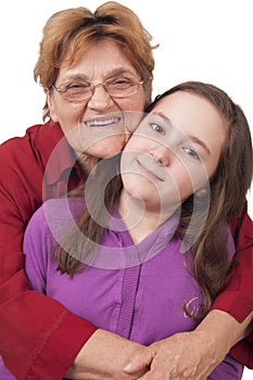 Grandmother and granddaughter hugging