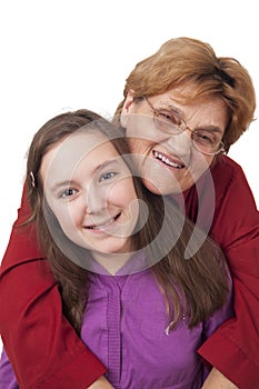 Grandmother and granddaughter hugging