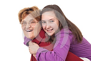 Grandmother and granddaughter hugging