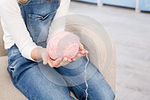 Grandmother and granddaughter knitting