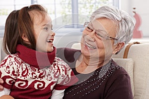 Grandmother and granddaughter laughing