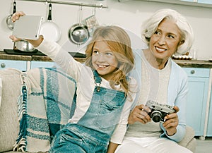 Grandmother And Granddaughter Making Selfie On New Smartphone