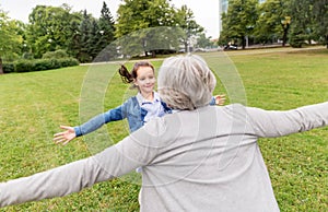 Grandmother and granddaughter playing at park