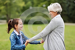 Grandmother and granddaughter playing at park