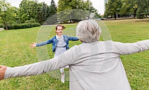 Grandmother and granddaughter playing at park