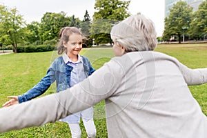 Grandmother and granddaughter playing at park