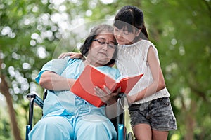 Grandmother and granddaughter reading