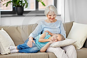 Grandmother and granddaughter resting on pillow