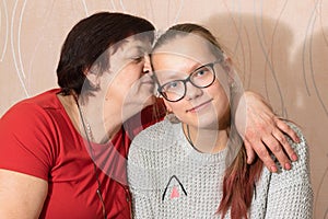 Grandmother with granddaughter and smartphone