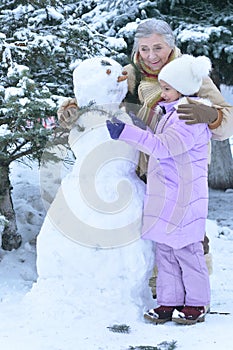 Grandmother with granddaughter smiling