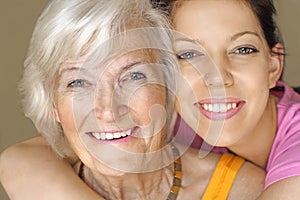 Grandmother and granddaughter smiling