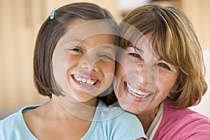 Grandmother and granddaughter smiling