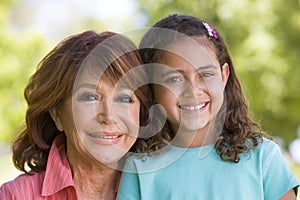 Grandmother and granddaughter smiling