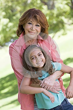 Grandmother and granddaughter smiling