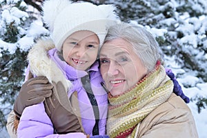 Grandmother with granddaughter smiling