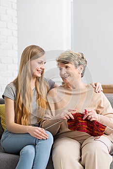 Grandmother and granddaughter on a sofa